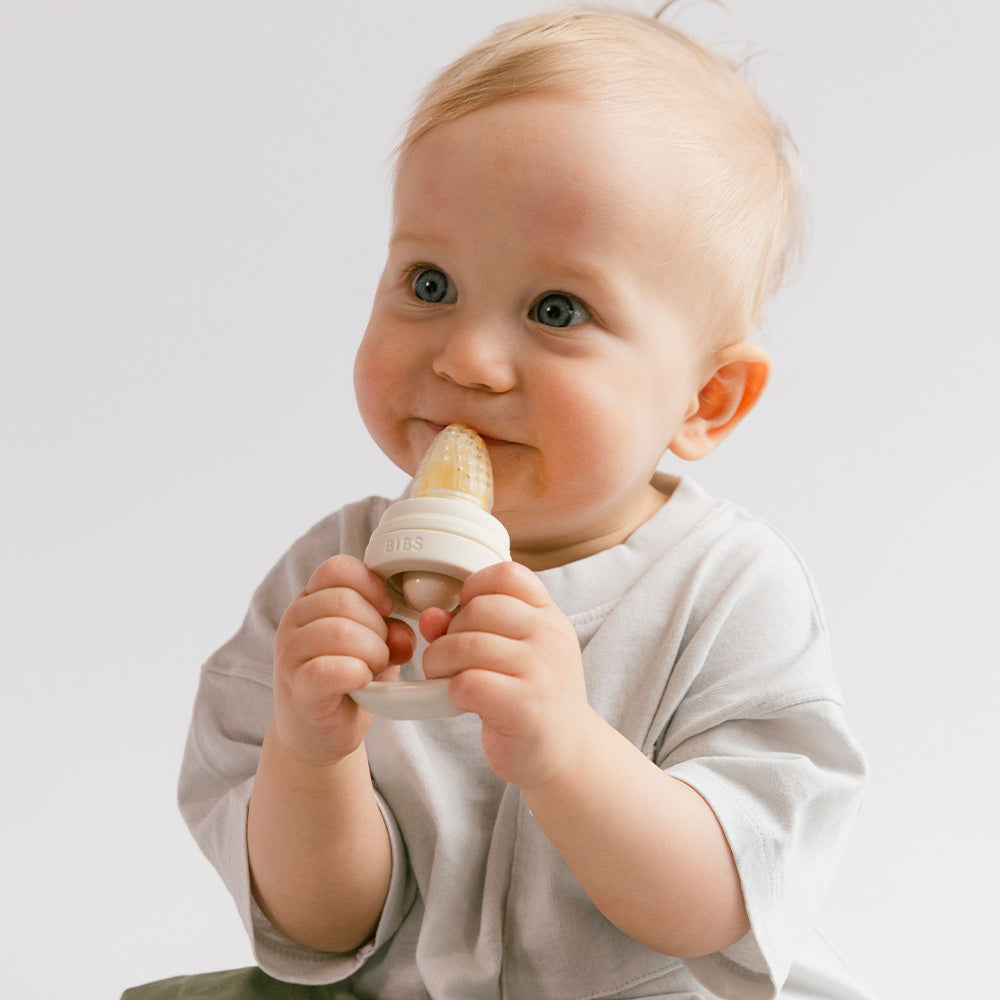 white baby feeder from bibs